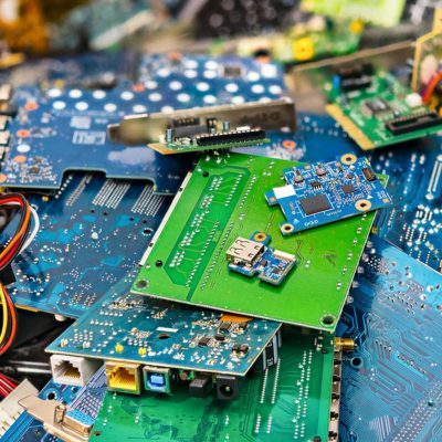 Connectors, PCB, notebook cards. Colorful blurry background from PC components. Mainboards, integrated circuit boards, UTP, USB. Idea of electronics industry, eco, sorting and disposal of electronic waste